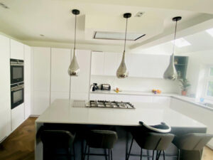 Modern fitted kitchen with stylish storage and quartz worktops in a UK home