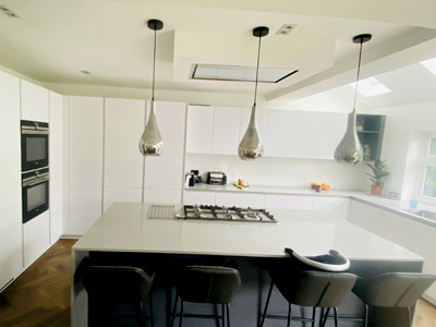 Modern fitted kitchen with stylish storage and quartz worktops in a UK home