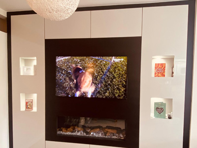 Modern small living room with space saving media wall fireplace design